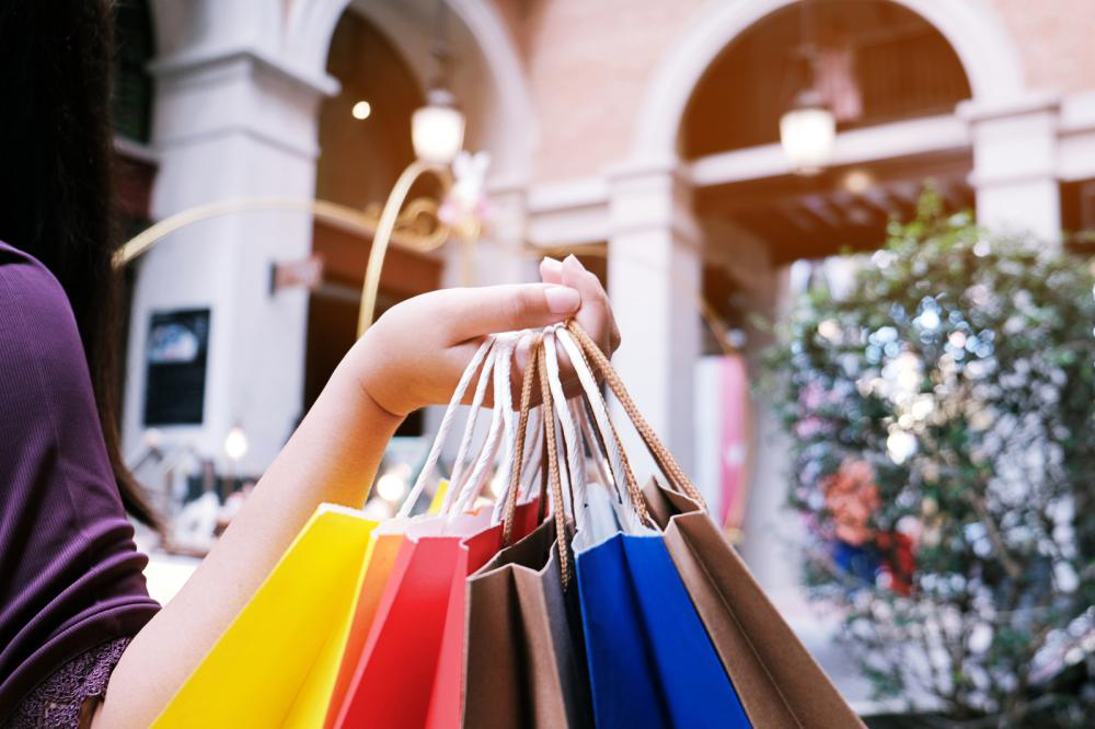 Chinese shopper holding bags